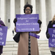 Pro-choice demonstrators stand outside the U.S. Supreme Court following oral arguments in the case of McCullen v. Coakley on Jan. 15, 2014.
Saul Loeb/Getty Images